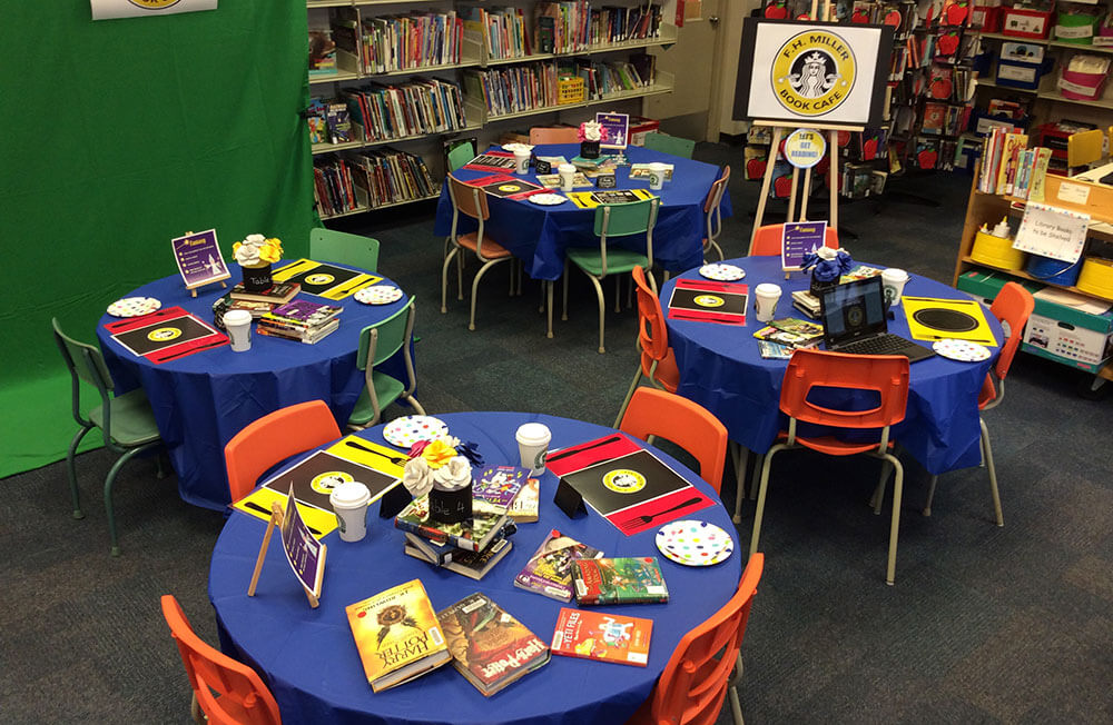 The library set up as a book cafe, with books and menus laid out on the tables